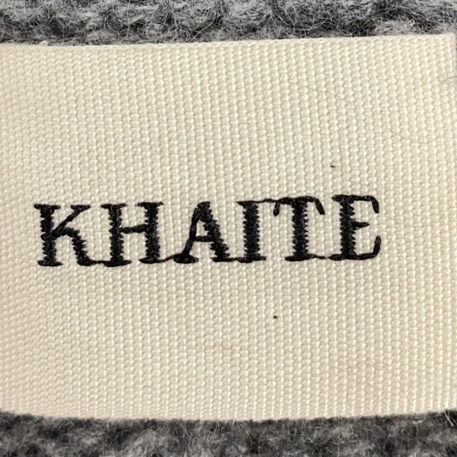 Khaite women's grey v-neck jumper with logo
